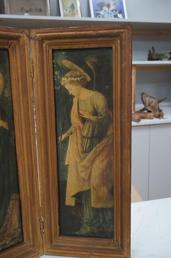 A diptych, colour prints, The Annunciation, overall 41cm high, housed in a folding gilt frame. Condition - fair